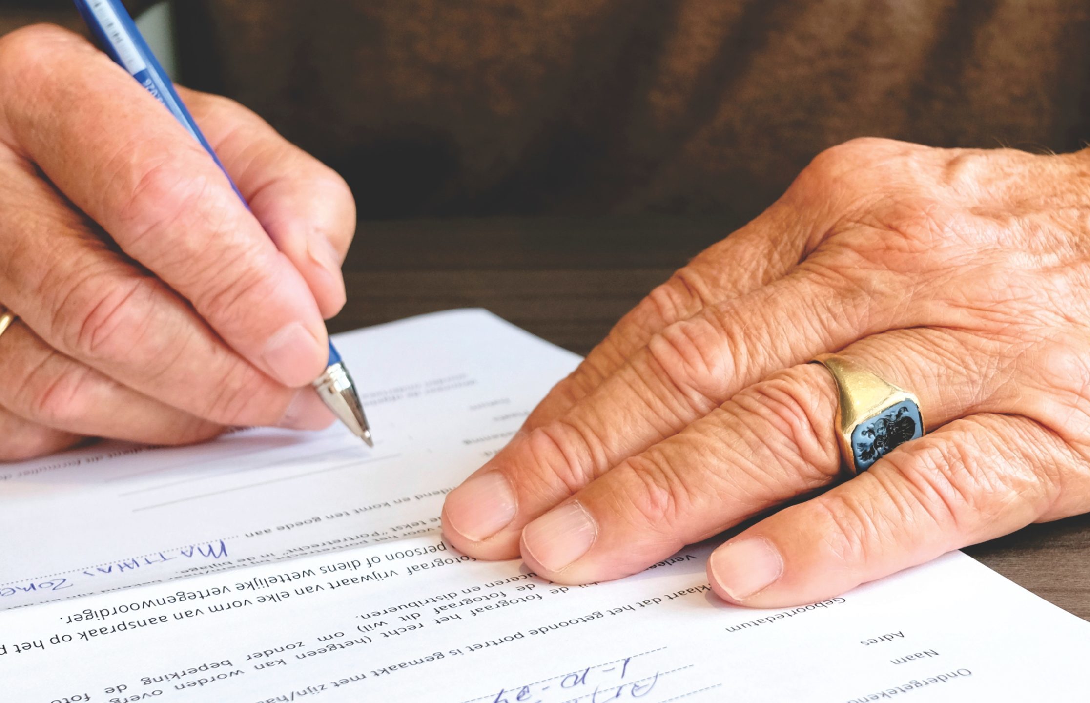 Man signing legal documents